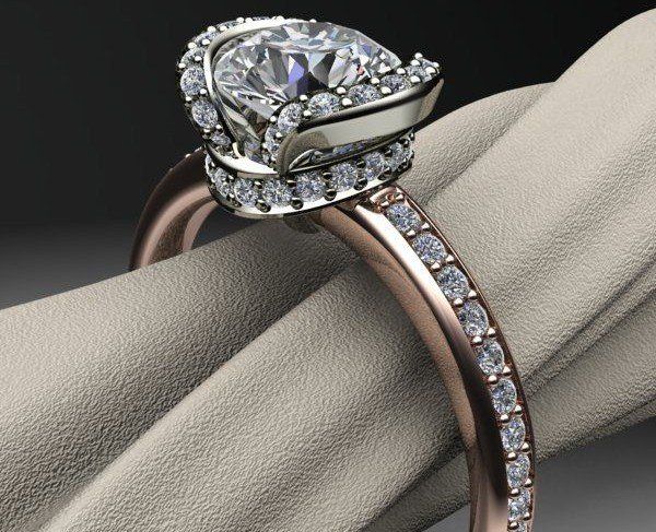 A close up of a diamond ring on a cloth