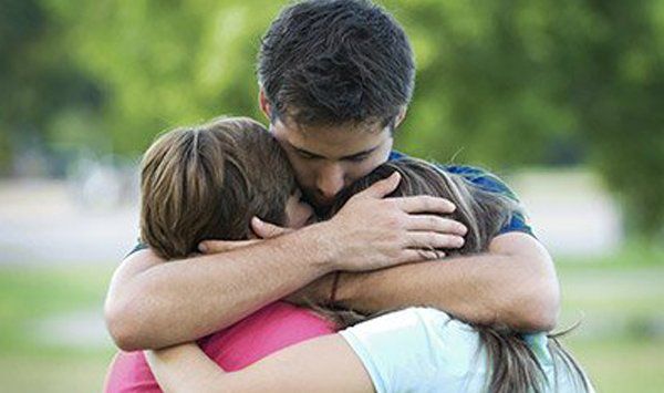 Man hugging children — Wallingford, CT — Alternative Paths Consulting LLC Man hugging children — Wallingford, CT — Alternative Paths Consulting LLC