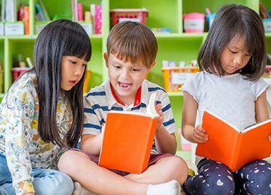 Toddler Daycare — Children Reading Books in Phenix City, AL Toddler Daycare — Children Reading Books in Phenix City, AL