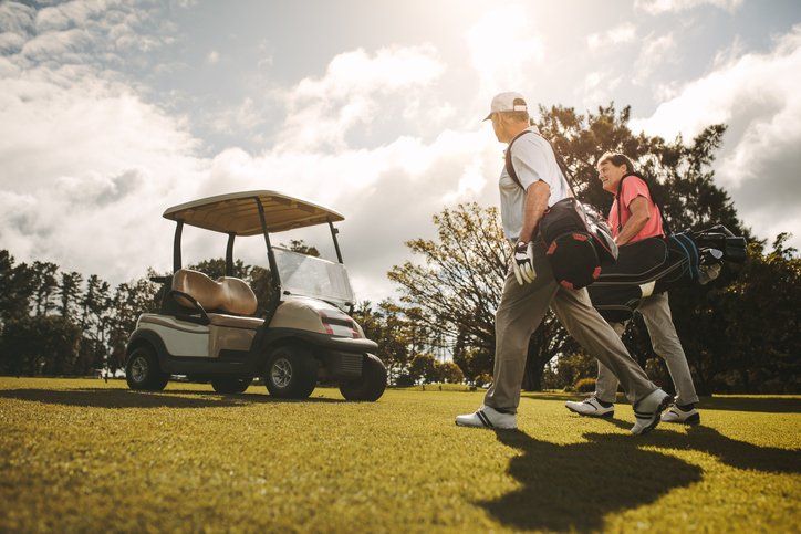 Two Men and Golf Cart — New Albany, IN — Russ Thomas Insurance Inc. Two Men and Golf Cart — New Albany, IN — Russ Thomas Insurance Inc.