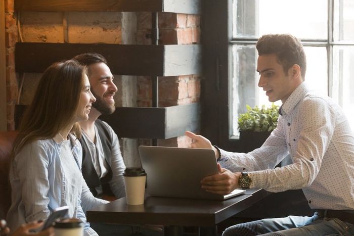 Insurance Agency — Man Doing Business Meeting With The Couple in New Albany, IN