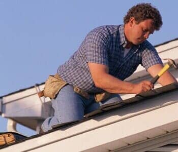 Man repairing roof - roofing in West Congers, NY Man repairing roof - roofing in West Congers, NY