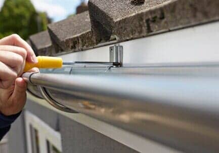 Man Replacing Gutter - gutters in West Congers, NY Man Replacing Gutter - gutters in West Congers, NY