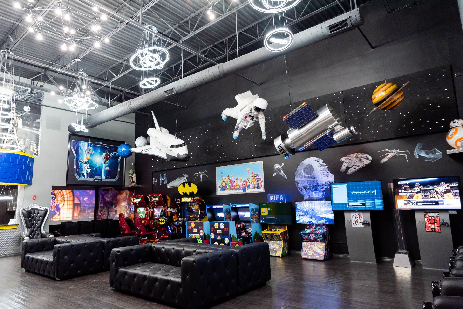 A large room with a lot of furniture and a mural on the wall.