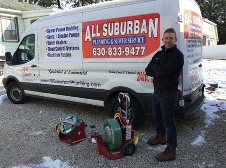 Plumber Near Me — Plumber Standing Beside the Truck in Chicago, IL Plumber Near Me — Plumber Standing Beside the Truck in Chicago, IL
