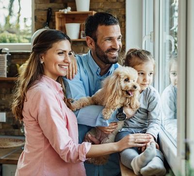 Family Looking Out the Window — Bucks County, PA — Ranniello Inc. Family waiting for fuel oil delivery in Bucks County, PA