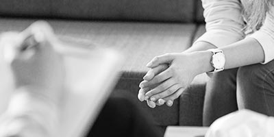 woman speaking to therapist