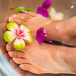 feet in water with flowers