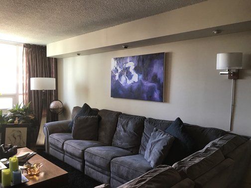 Living room install of art commissioned from ArtByK2, Hamilton