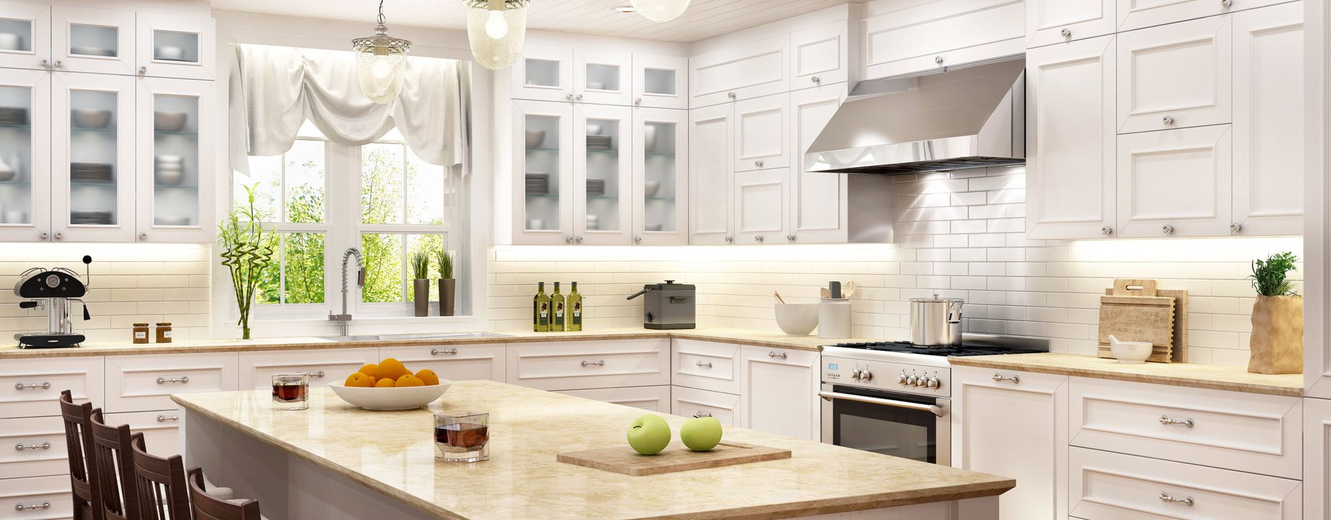 A kitchen with white cabinets , granite counter tops , stainless steel appliances and a large island.