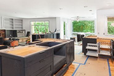 A kitchen is being remodeled with new cabinets and counter tops.