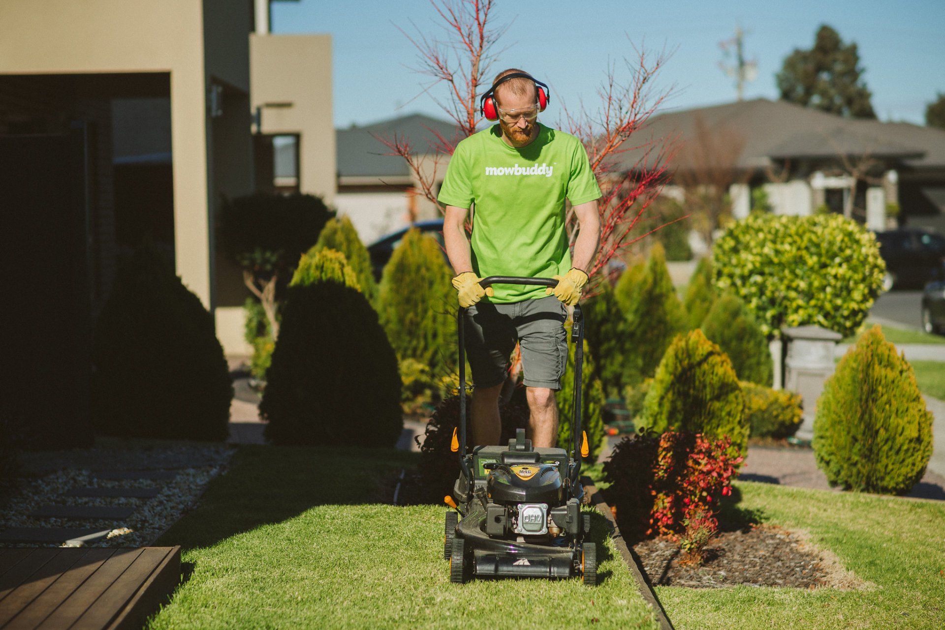 Mowbuddy gardener lawn mowing a front garden