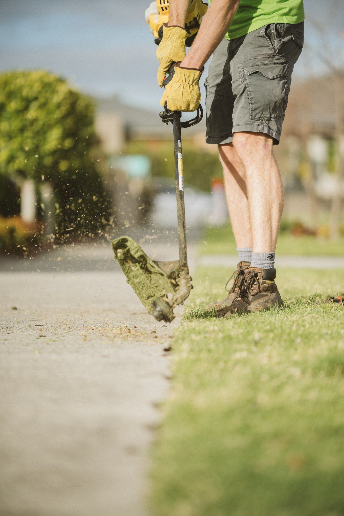 Mowbuddy gardener using a whipper snipper