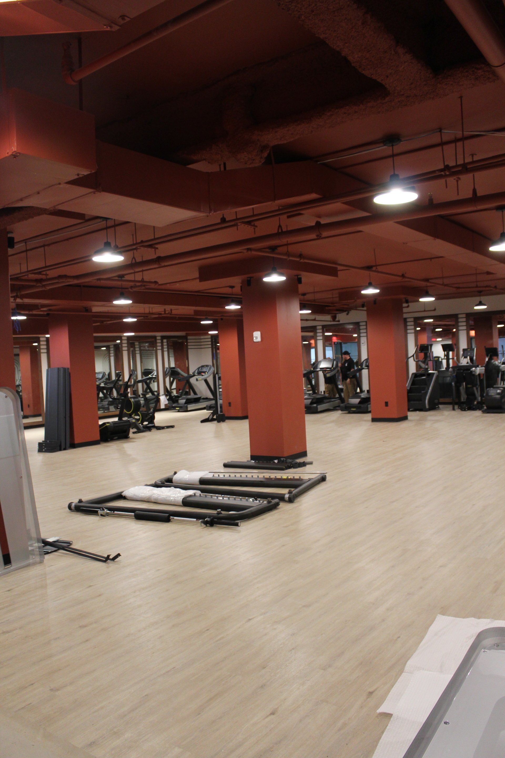 Workout space with treadmills and weight machines at Twenty Exchange Place gym.