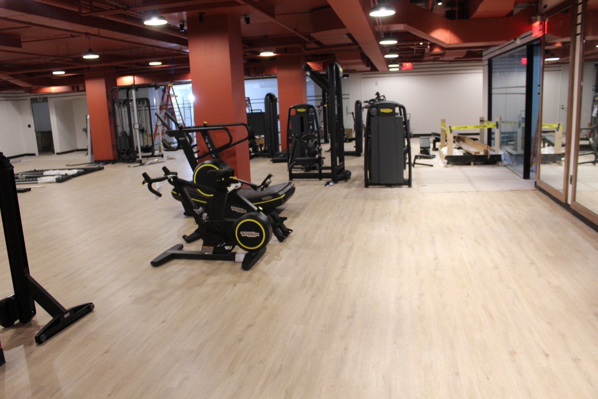 Open gym space with exercise machines and free weights at Twenty Exchange Place