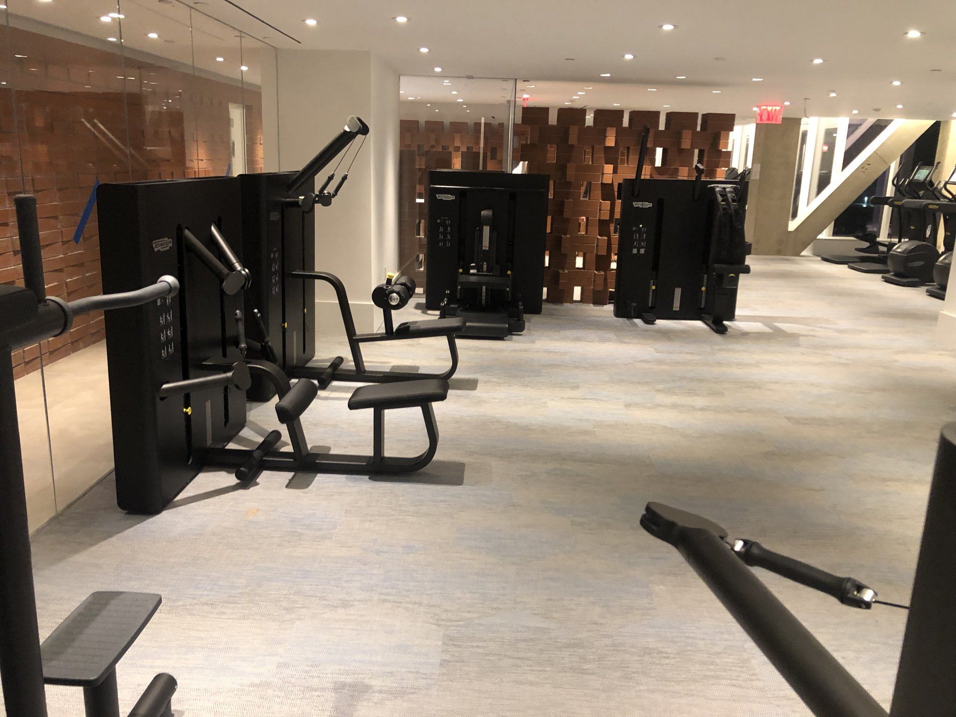 Apartment gym with weight training equipment and modern design features