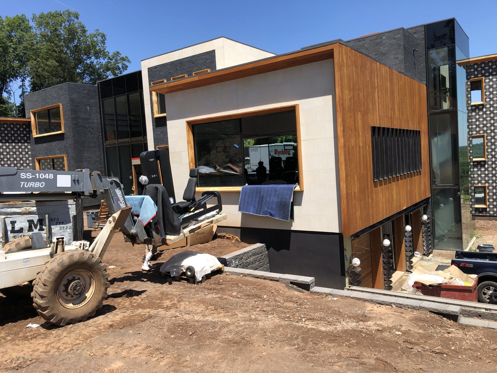 Modern residential home exterior under construction in Bernardsville with wood accents.
