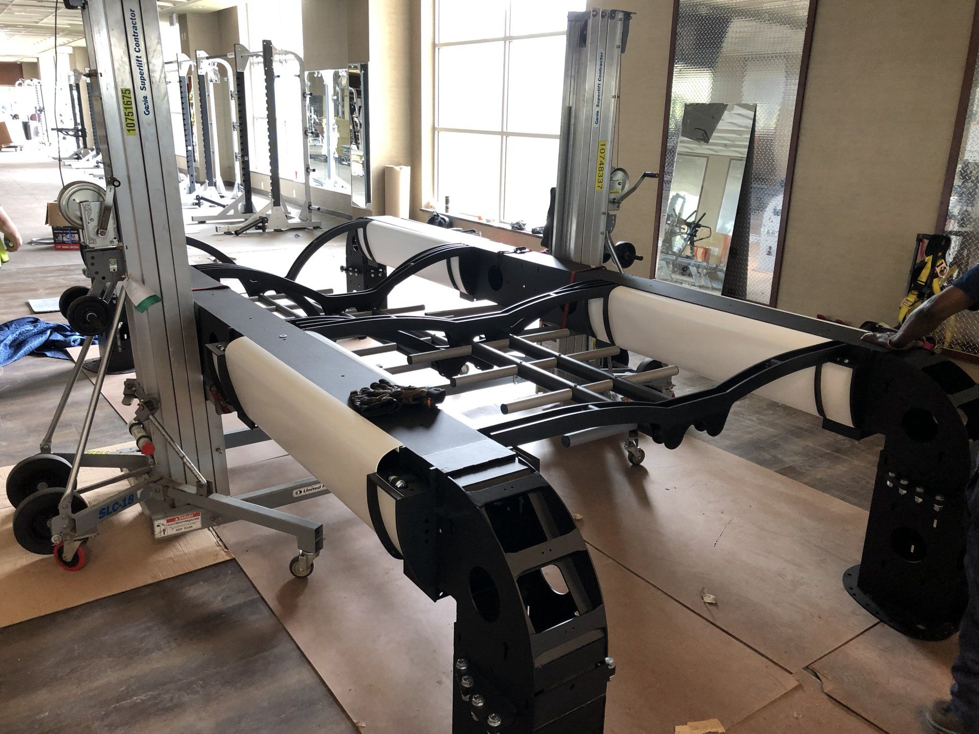 Close-up of new fitness equipment being installed at Lifetime Athletics gym.