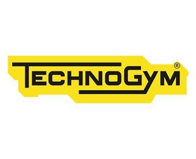 Technogym fitness equipment logo in bold black letters on a yellow background.