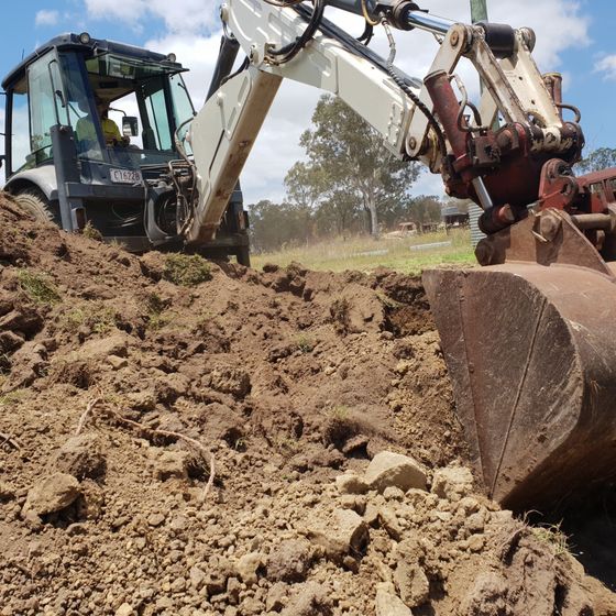 crane being used to dig the earth
