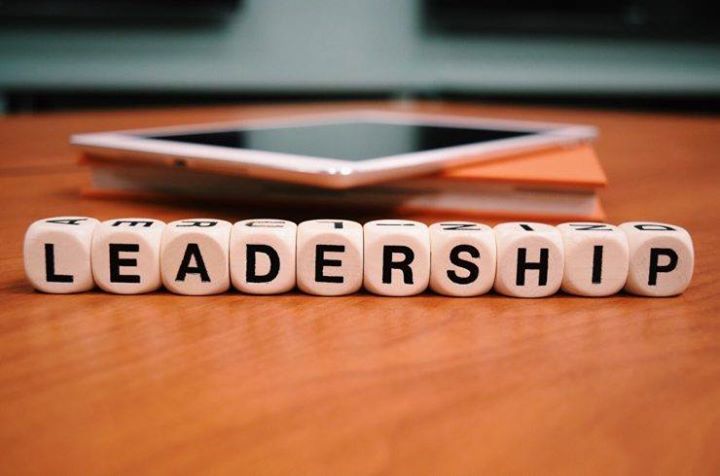 The word leadership is written on wooden cubes on a table.