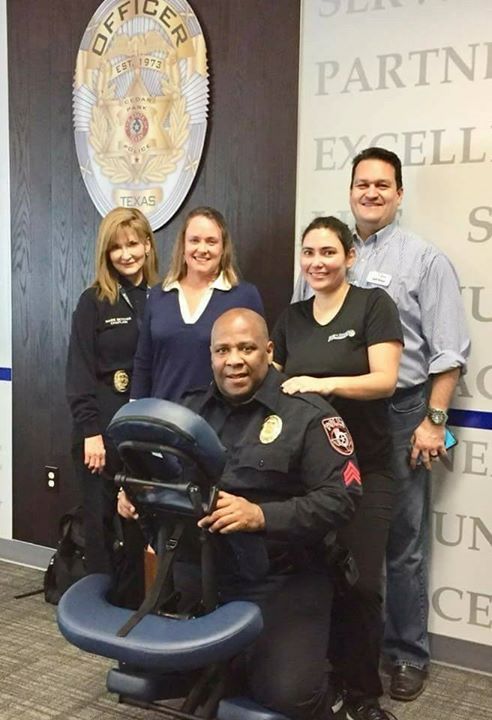 A group of police officers are posing for a picture