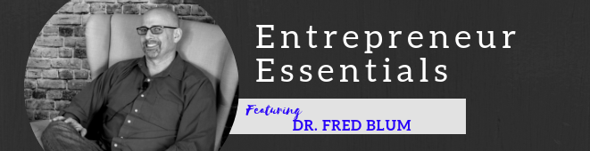 A black and white photo of a man and the words entrepreneur essentials