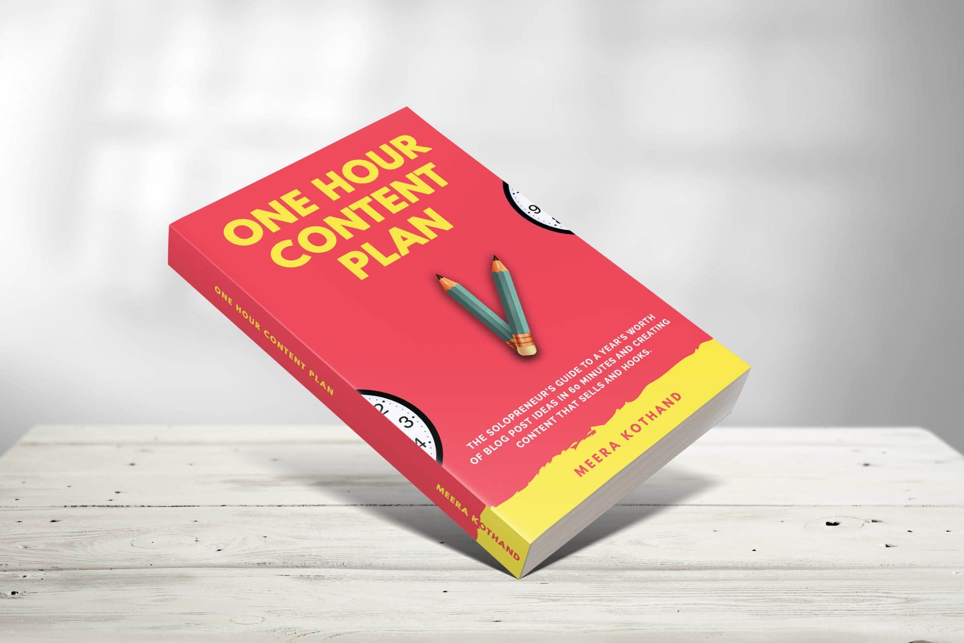 A book titled one hour content plan is sitting on a table.