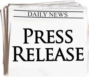 A stack of newspapers with the words press release on it.