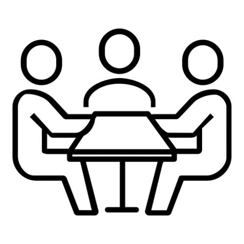 A group of people are sitting around a table.