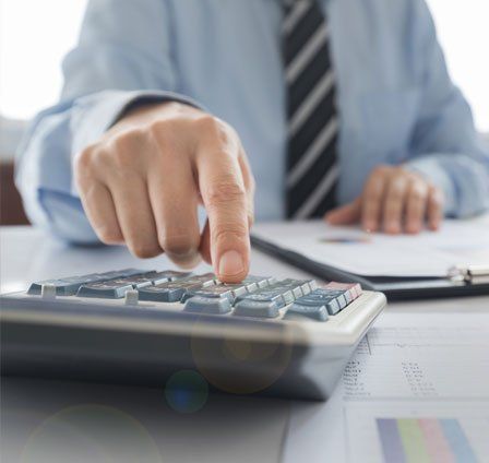 Accountant Using the Calculator — Olympia, WA — Bliss & Tuttle, CPAs Accountant Using the Calculator — Olympia, WA — Bliss & Tuttle, CPAs