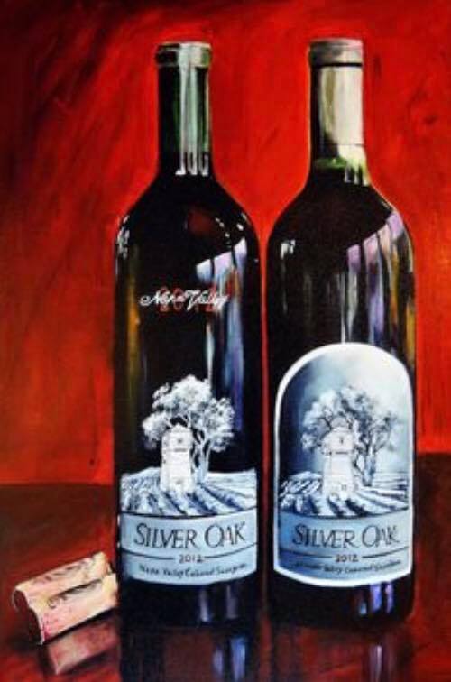Two bottles of silver oak wine next to a cork