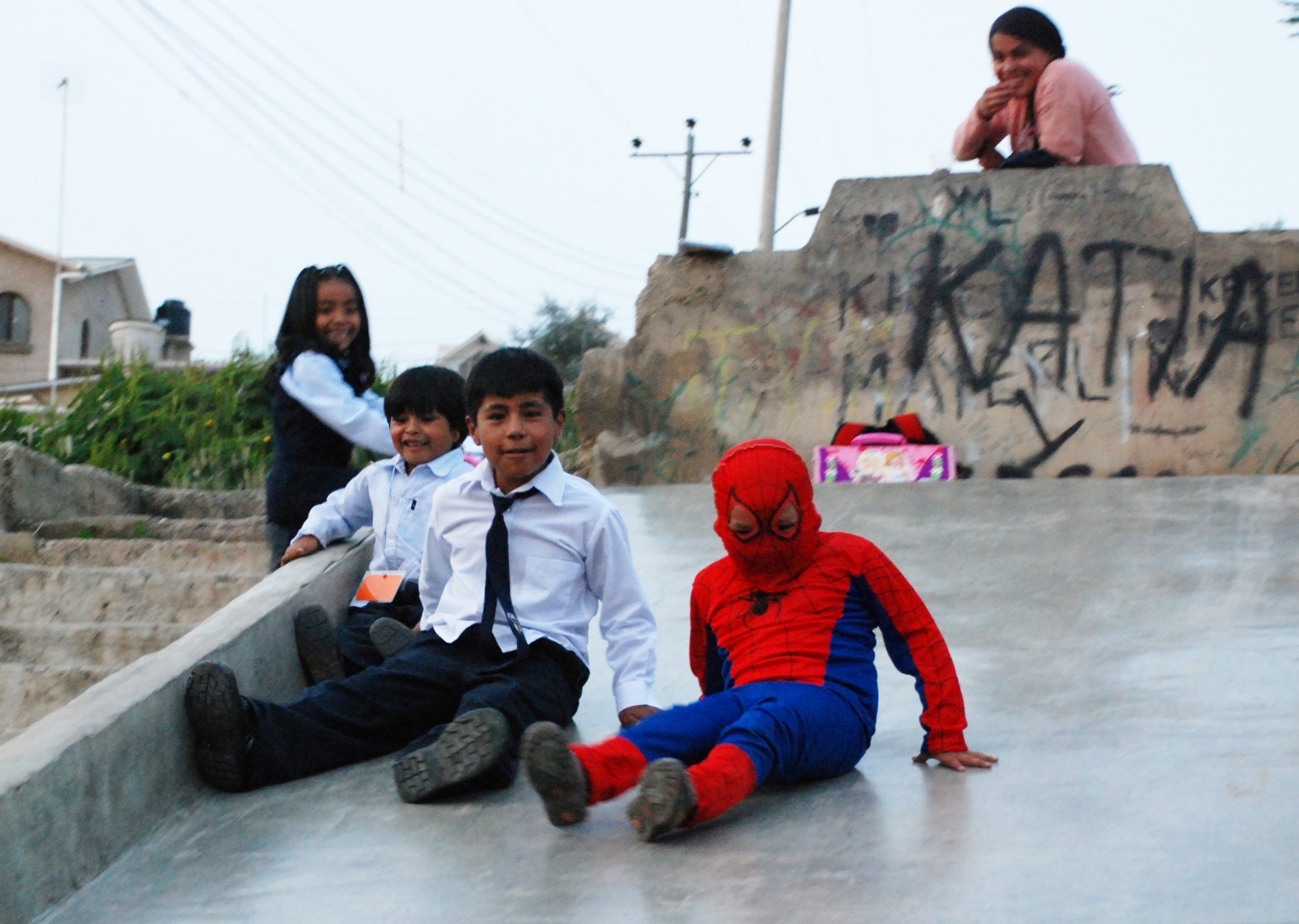 School children and Spiderman at play in Cochabamba, Bolivia.