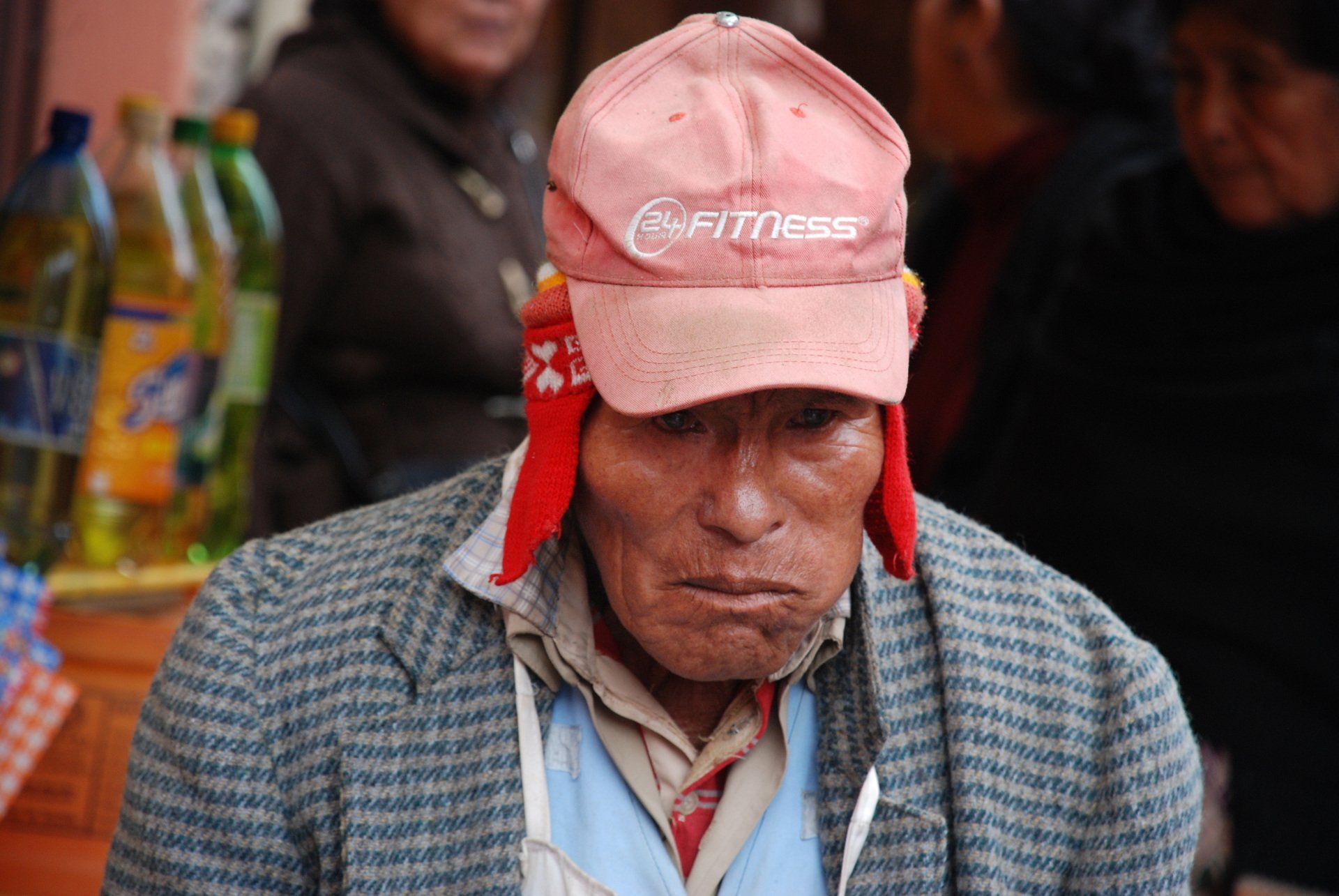 Man wearing LA Fitness hat in La Cancha in Cochabamba, Bolivia.