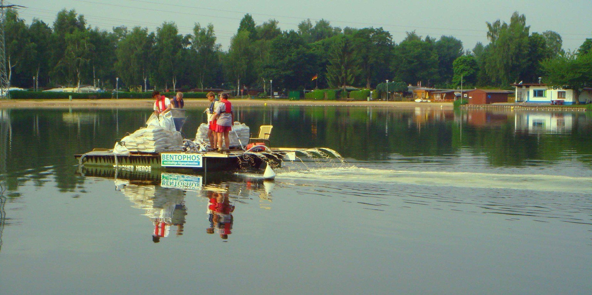 A group of people are riding a boat on a lake.