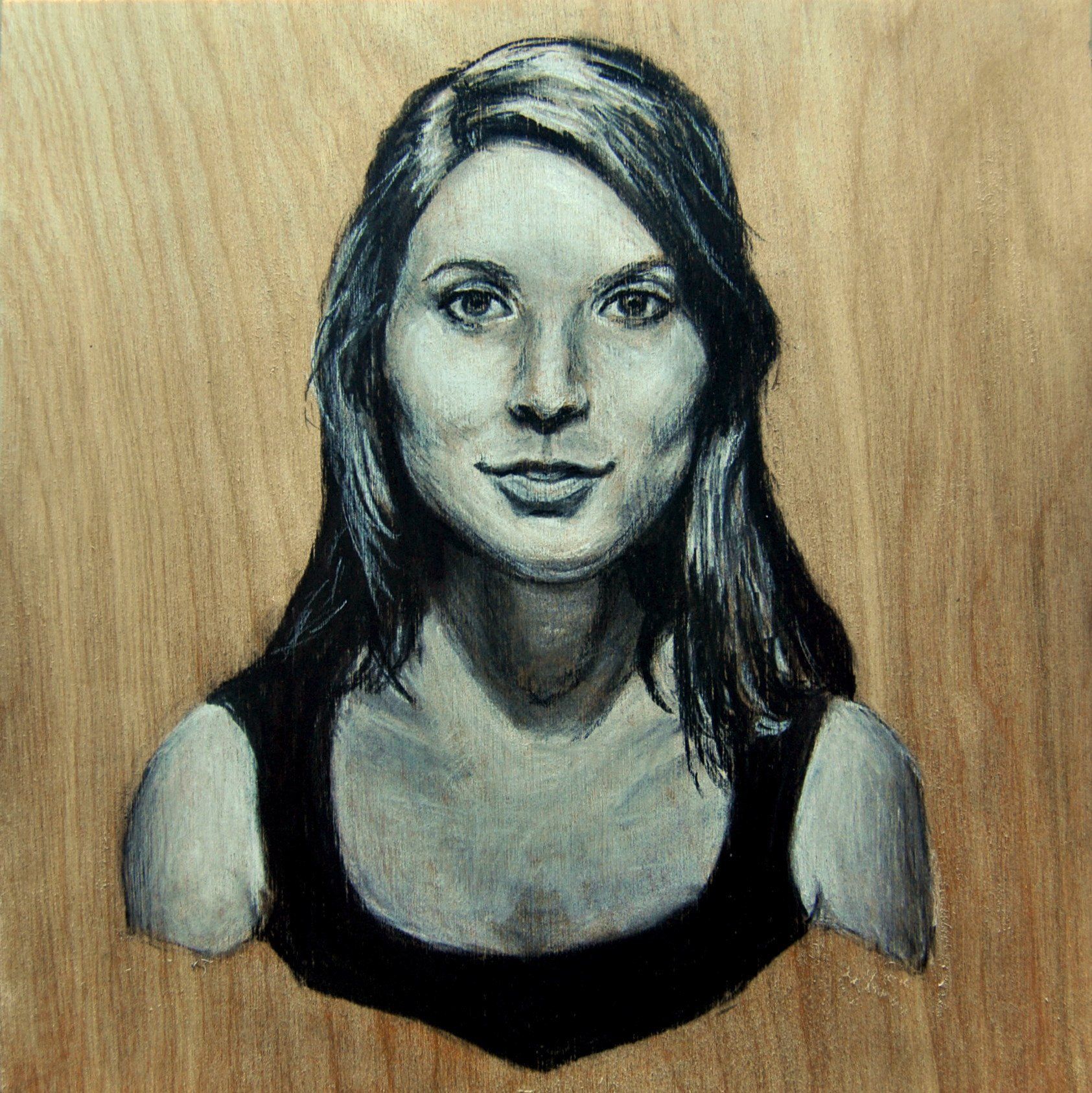 Charcoal portrait of a woman with long hair, wearing a black top, against a wood grain background.