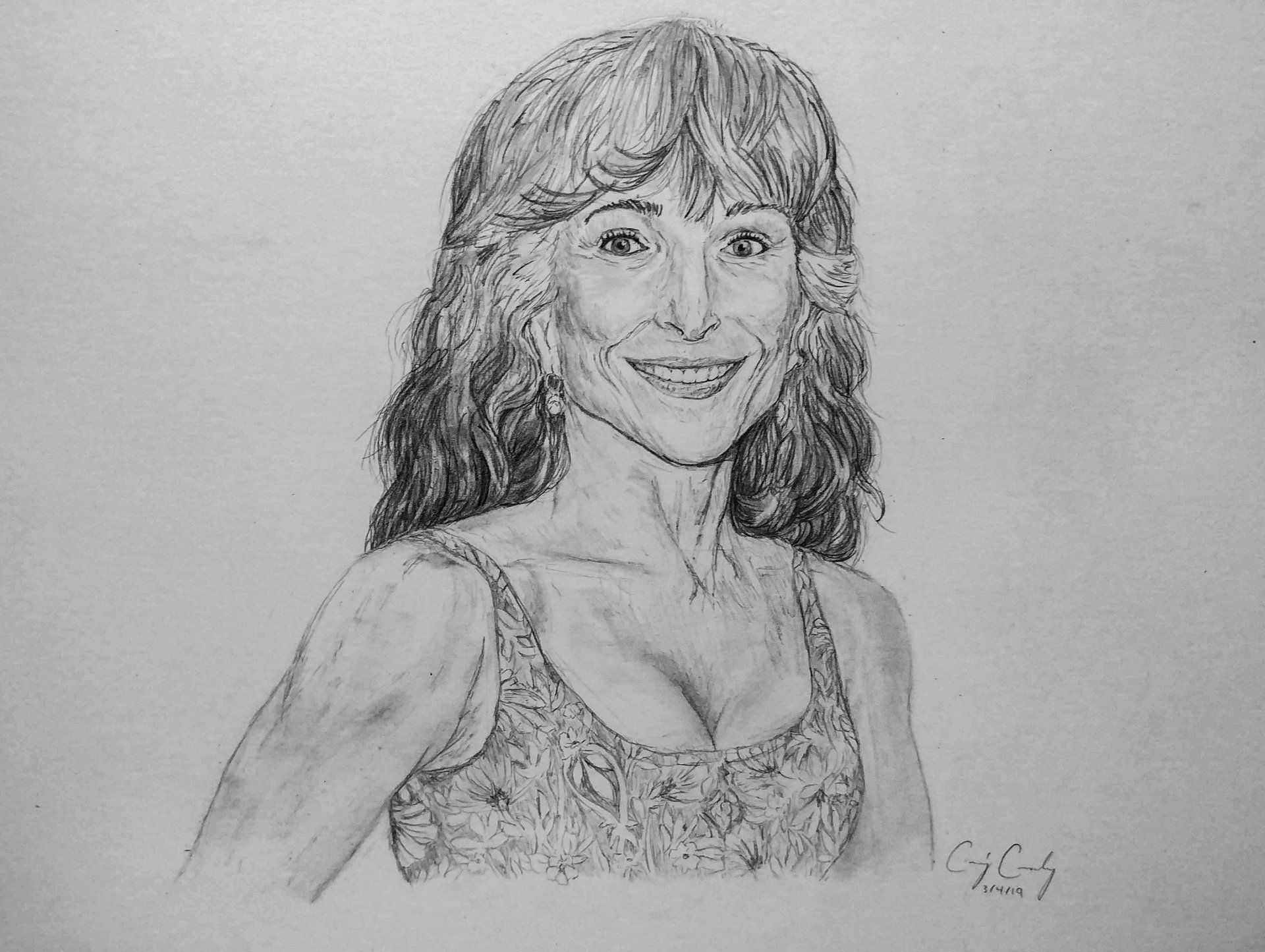Pencil sketch of a woman smiling, wearing a sleeveless patterned top.