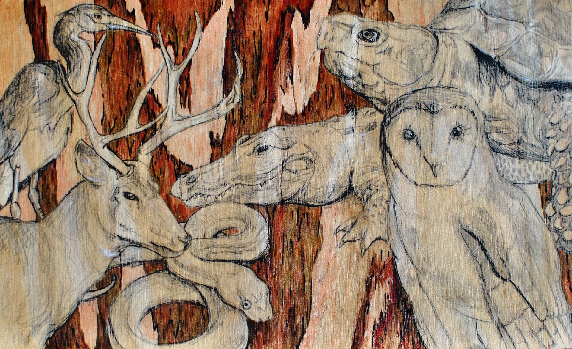 Wood carving of animals: deer, snake, horse, owl, turtle, and bird.