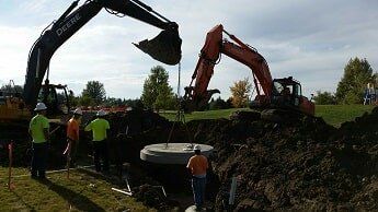 tractor lowers concrete circle - construction in WY