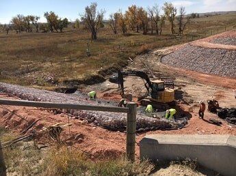 construction workers and tractor - commercial construction in WY