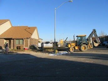 tractor on road - commercial construction in WY