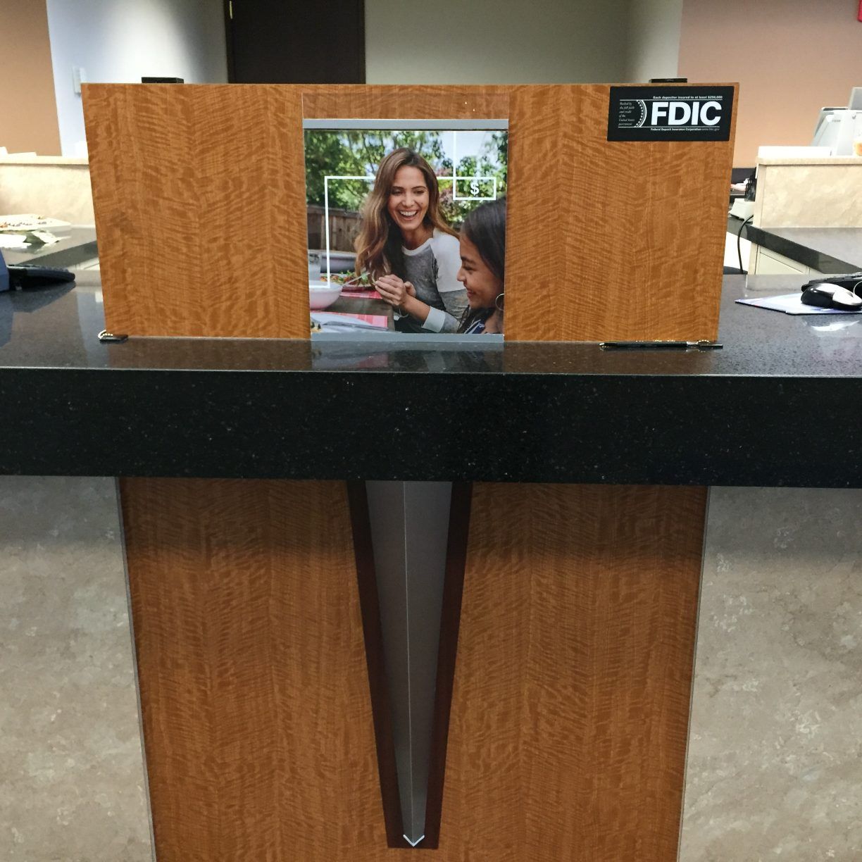 A wooden box with a picture of two women and the word fdic on it