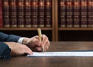 Lawyer signing papers - Law Office in York, PA