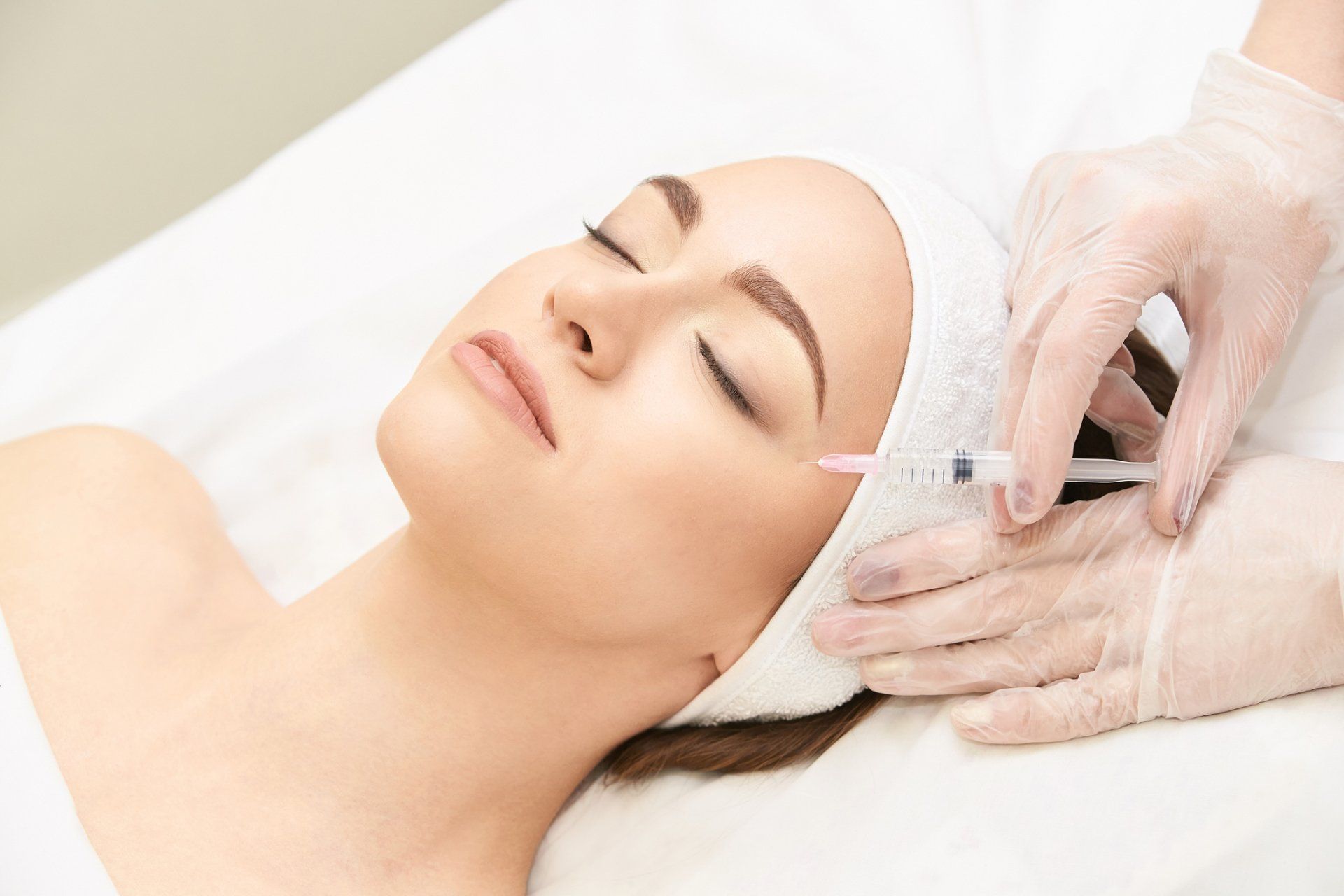 A Woman Receiving Injectables Near Toms River, NJ Fillers being applied near Toms River, NJ