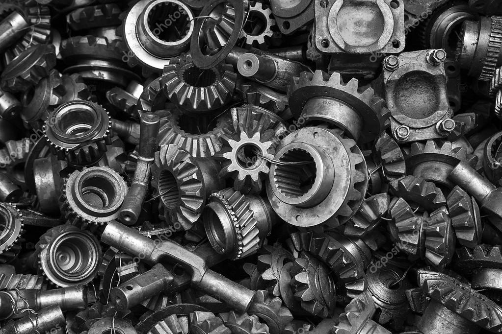 A black and white photo of a pile of metal parts.