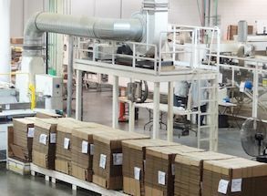 A warehouse filled with lots of cardboard boxes.