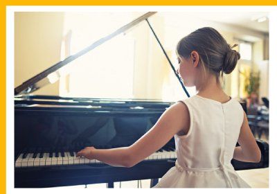 little girl playing the keyboard