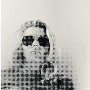 A black and white photo of a woman wearing sunglasses