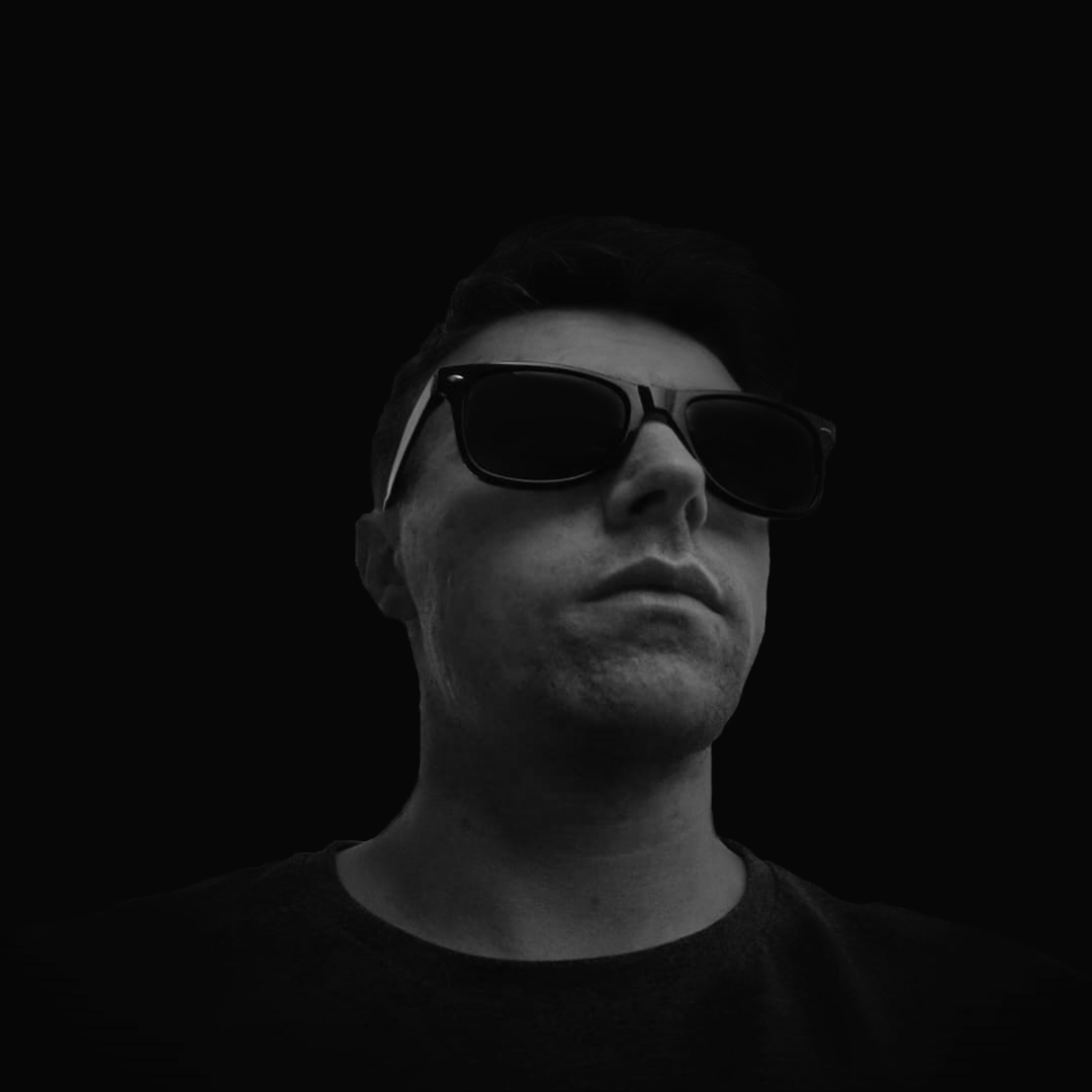 A black and white photo of a man wearing sunglasses.