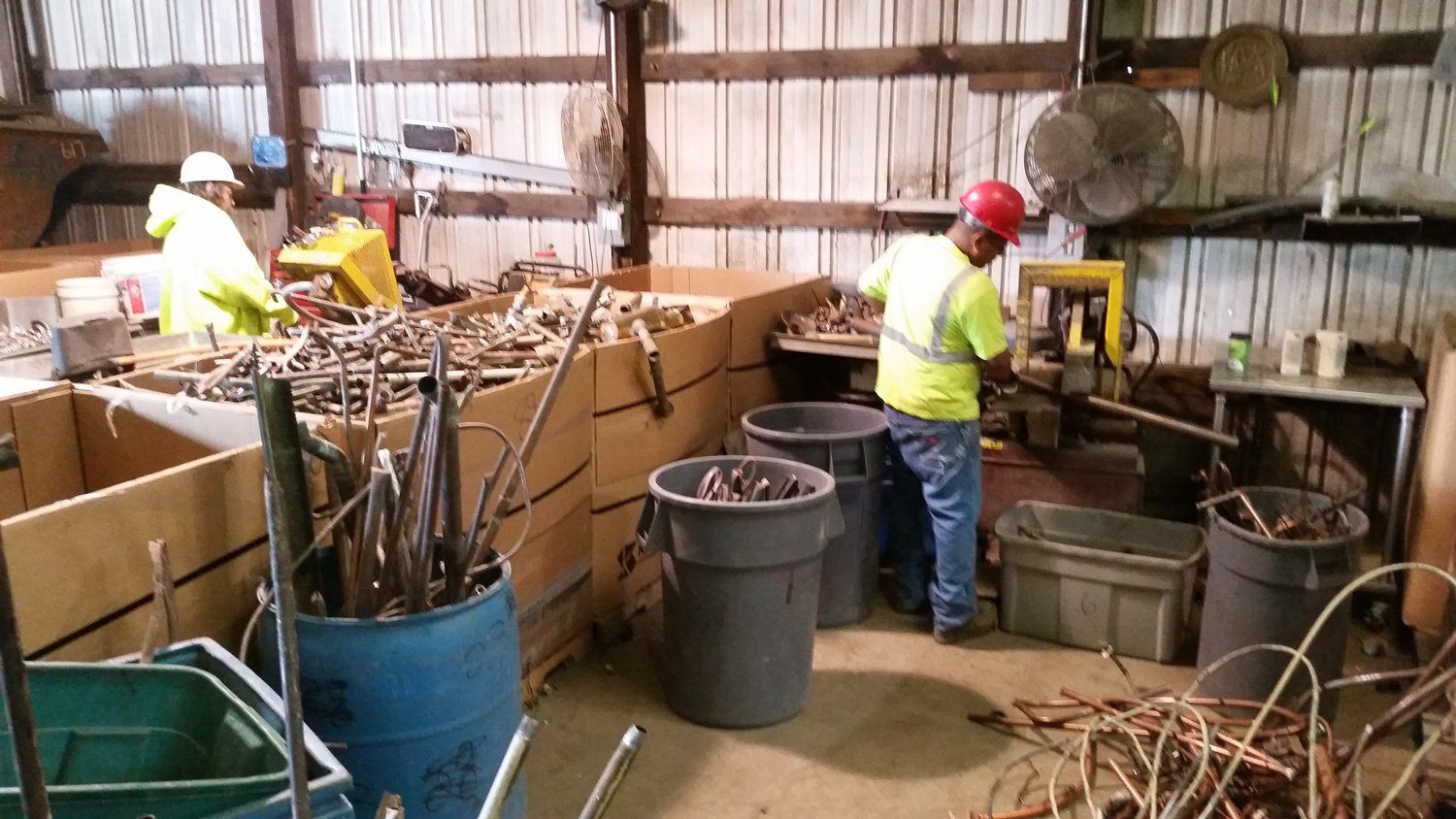 Workers Sorting Ferrous And Non-Ferrous Metals — Freehold, NJ — Beacon Scrap Iron and Metal Co. Workers Sorting Ferrous And Non-Ferrous Metals — Freehold, NJ — Beacon Scrap Iron and Metal Co.